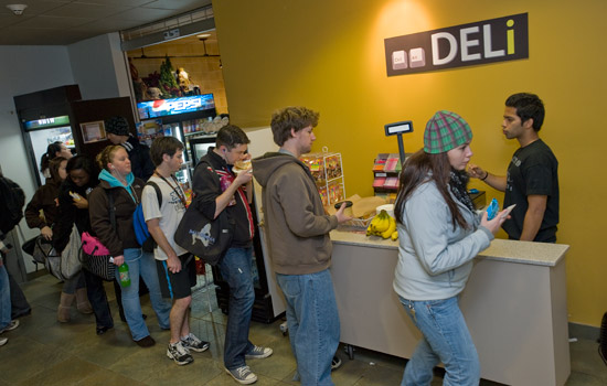 line of students waiting to check out at Ctrl Alt Deli.