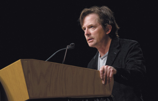 Michael J. Fox at a podium.