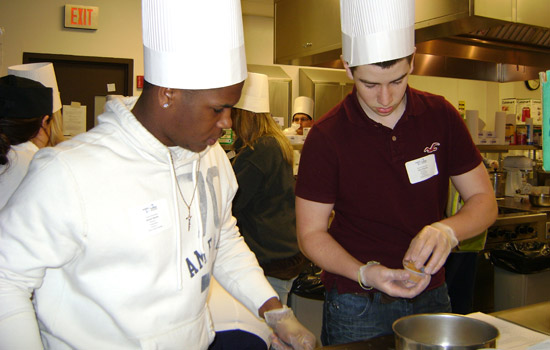 Picture of two people cooking