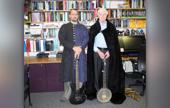 RIT President posing in costume with people