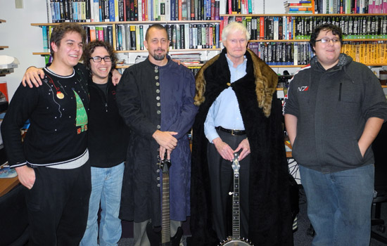 RIT President posing in costume with people