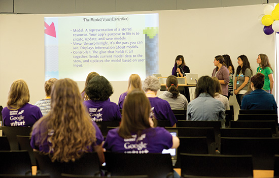 groups of students presenting final projects with audience.