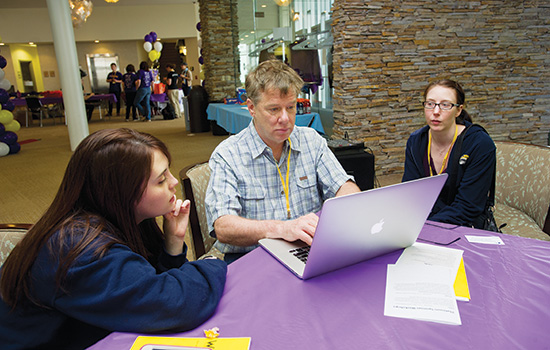 two students get help from mentor.