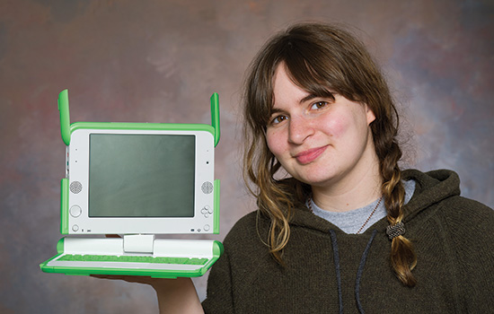 Person posing with computer