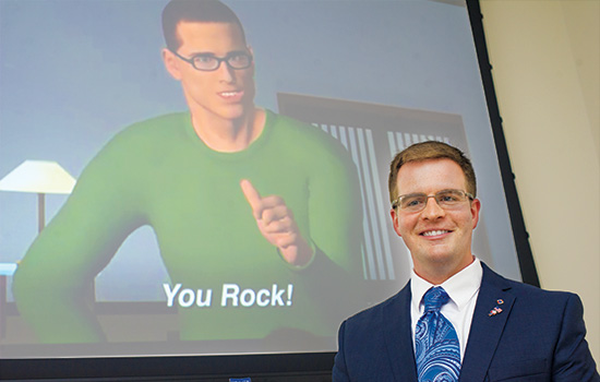 man stands in front of image of man saying you rock.