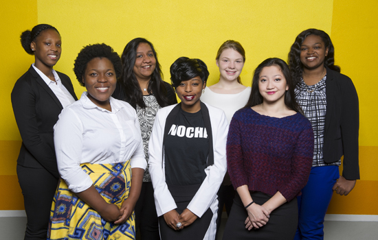 group of seven women posing for a photo.