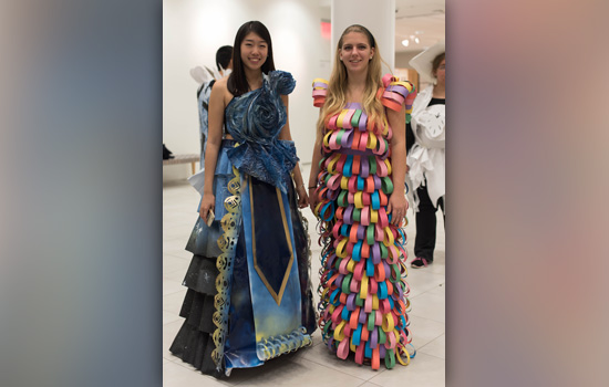 Two people wearing handmade dresses