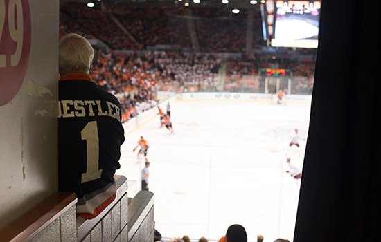 RIT President Destler watching hockey game