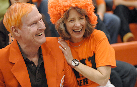 RIT President Bill Destler and his wife celebrating hockey game