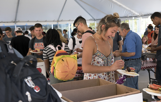 People getting food in tent