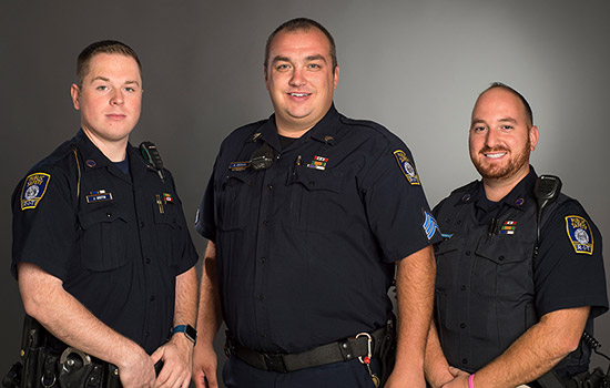 Three Public Safety officers posing for camera