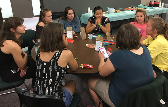 People gathered around table at event