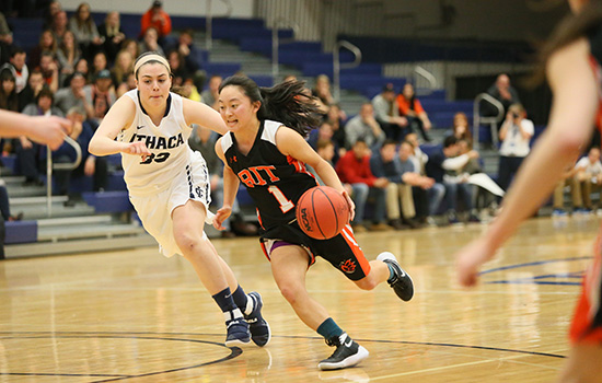  action shot of Cor Okada playing as basketball point guard.