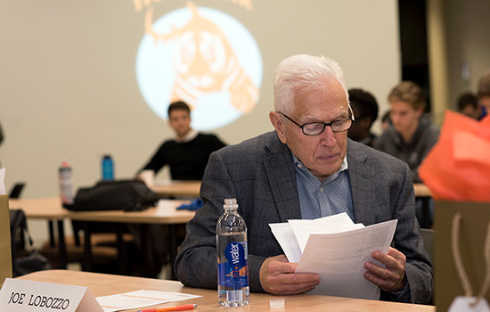 senior citizen looking at paperwork.