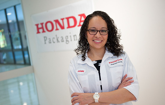  Jasmine Oregel posing in front of Honda Packaging logo.