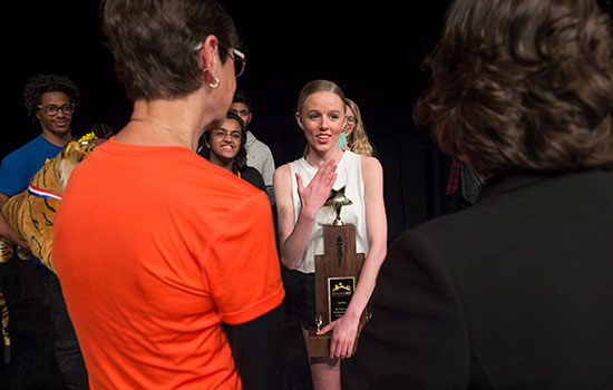 Victoria Covell accepting the award for winning President Monsun's Performing Arts Challenge.