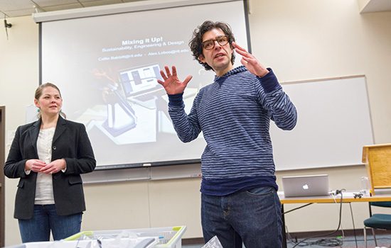 a professor lecturing in front of a projector