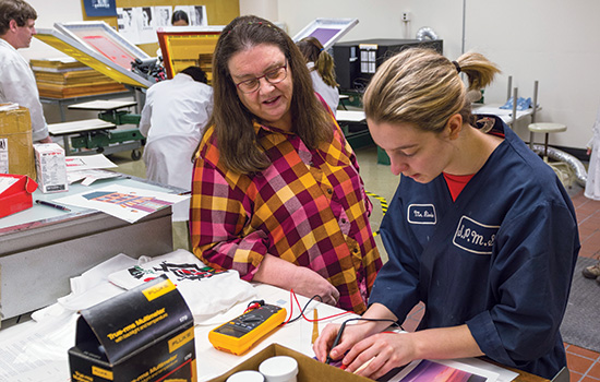 2 people working on an electrical project