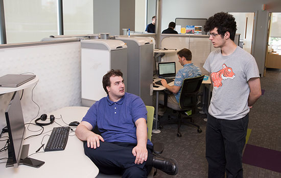 two students conversing at Second Avenue Learning.