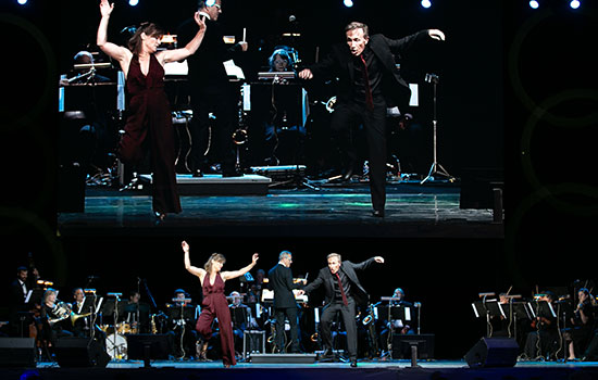 Beverly and Kirby Ward tap dancing on stage.