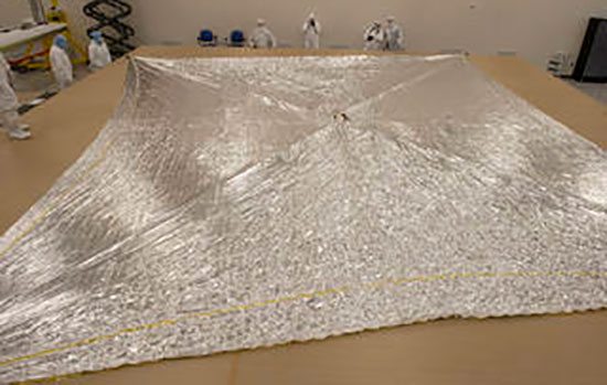 image of solar sail laid out on floor.
