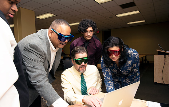 group of people wearing colored visors for capstone project.