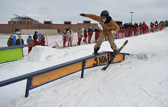 person skiing on a railing.