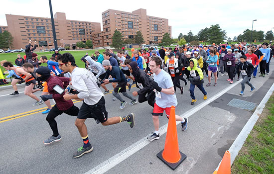 action shot of people running during the brick city 5k.